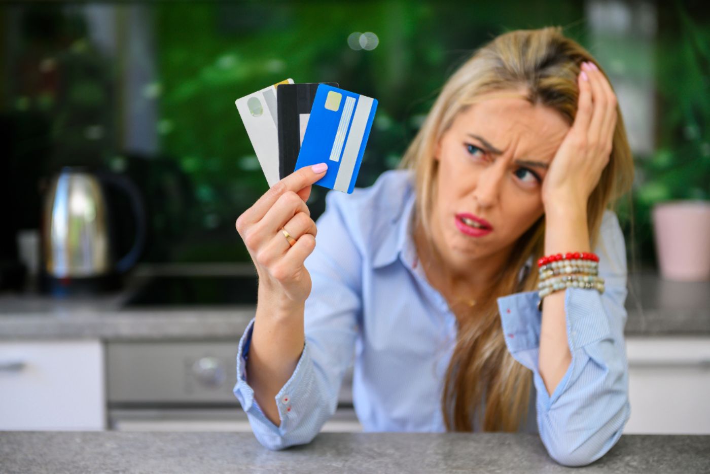 Woman stressed about credit cards and debt management