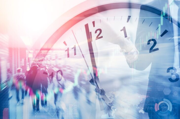 Business people walking as clock ticks
