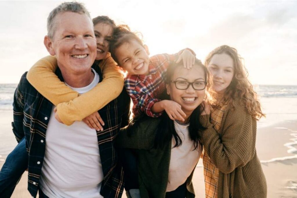 group of family having a good time in the beach